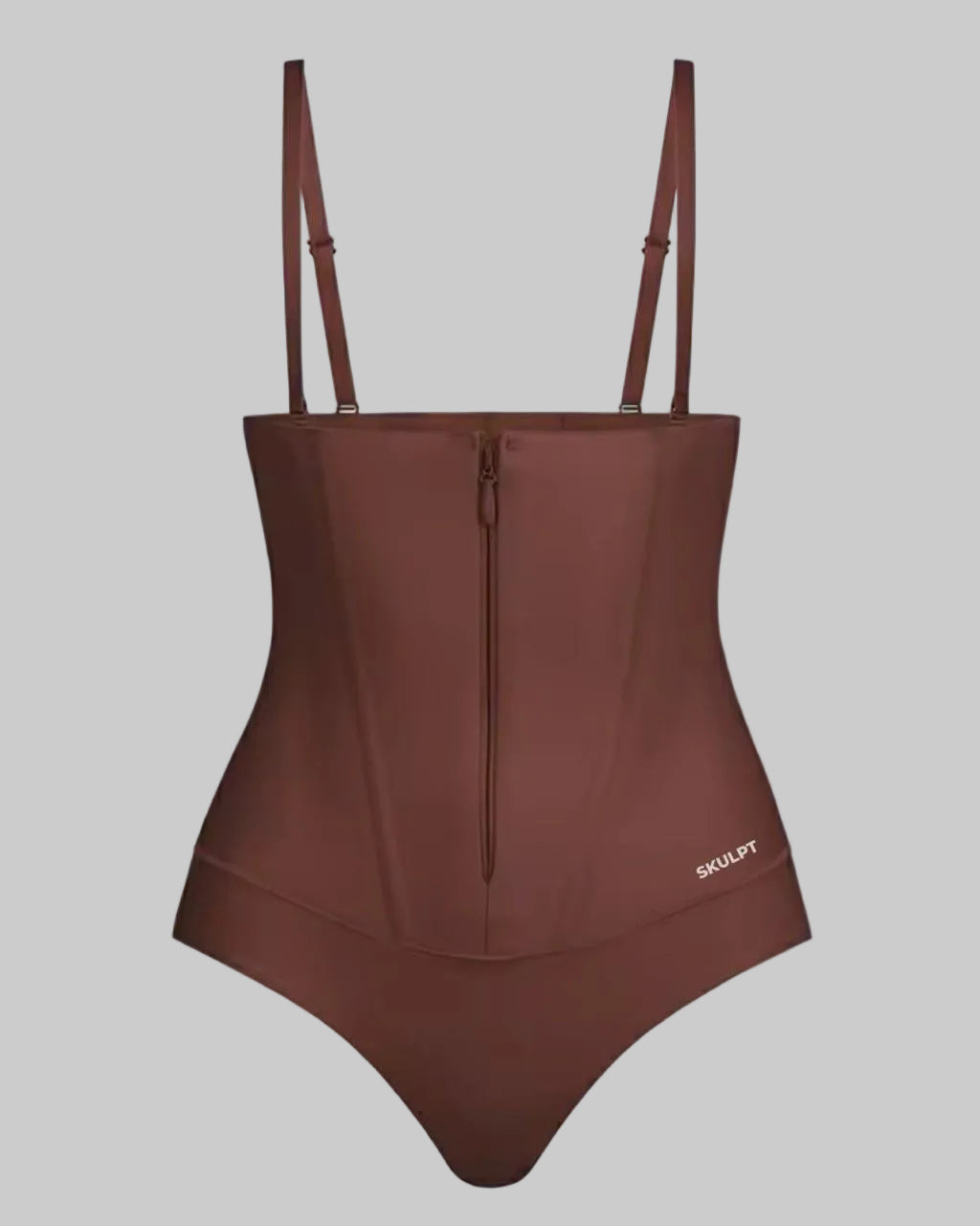 Brown swimsuit with thin straps on a white background