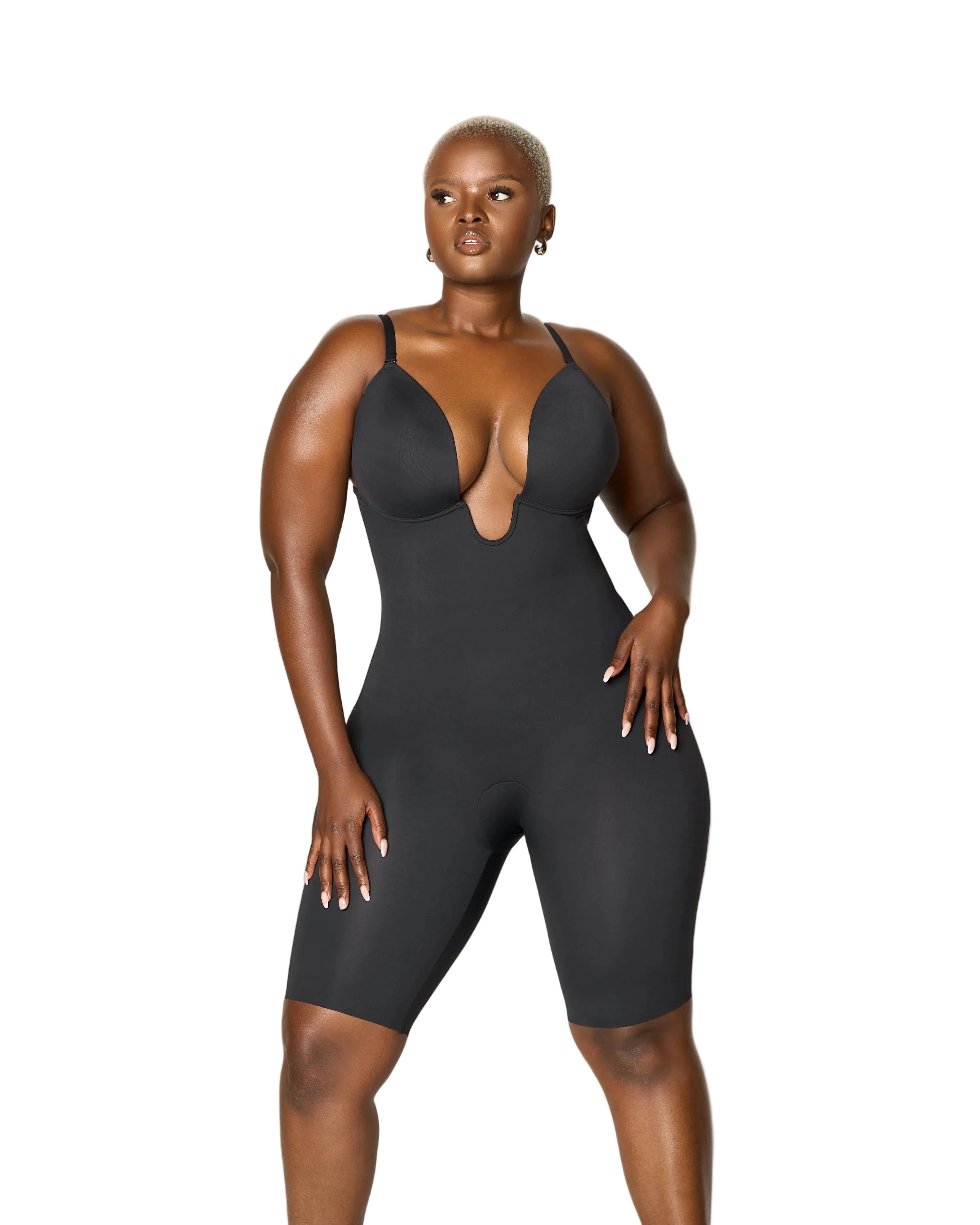 Person wearing a black bodysuit against a white background